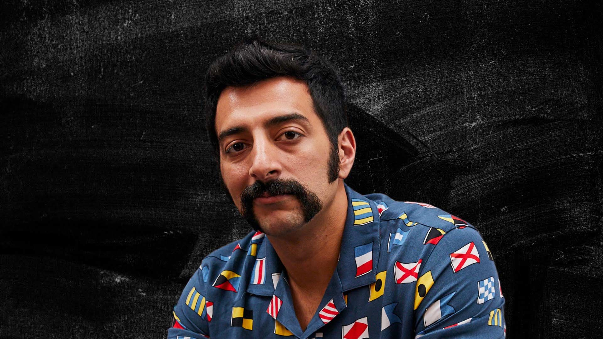 Photo of handsome man with a superb black moustache.